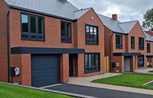 Anthracite Grey Window Surrounds have been used to emphasise the windows to the right of the front door