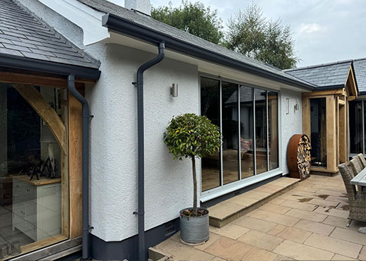 AX SnapFix Moulded Gutters and round downpipes in RAL 7015 Slate Grey Devon case study image 001