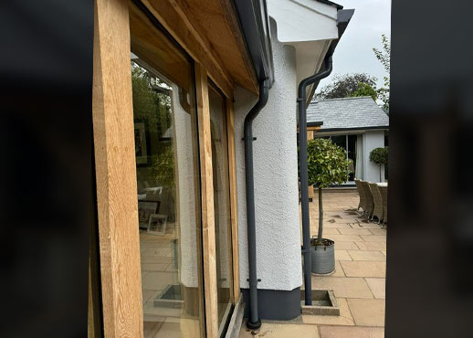 AX SnapFix Moulded Gutters and round downpipes in RAL 7015 Slate Grey Devon case study image 006